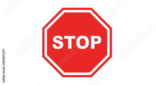 A classic red octagonal stop sign with large white lettering
