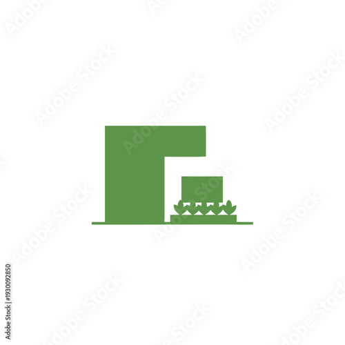 Green building with courtyard and decorative shrubs