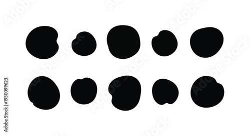 Collection of irregular black ink blobs and spots.