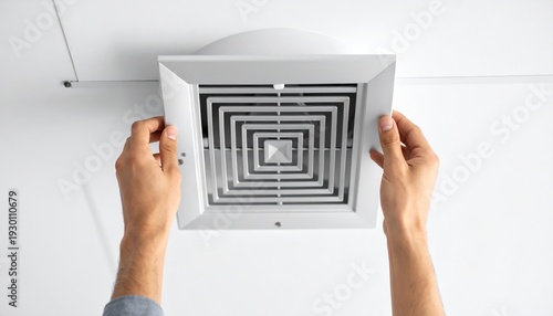 Hand Removing Air Vent From Ceiling for Cleaning