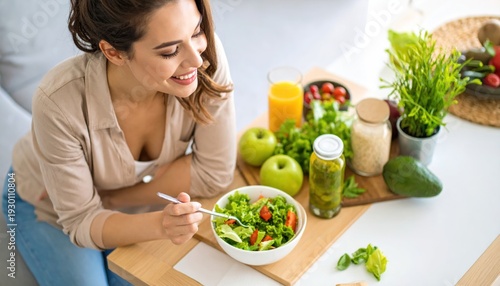 Woman eating healthy salad with fresh vegetables.