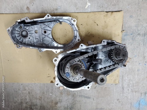 Transfer Case Open, View of Chain and Gears, Mechanic Working