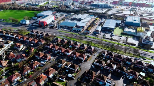 Wallpaper Mural aerial drone shot high angle over the Millbrook suburban housing area estate in Southampton at sunset with trees, homes and nature surrounding. Shot in winter with traffic and cars driving the streets Torontodigital.ca