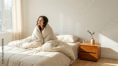 Peaceful Person Sleeping in a Sunlit Minimalist Bedroom with Linen Bedding for World Sleep Day Concept and Mental Wellness Restoration
