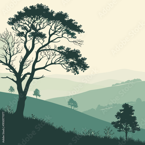 Dark silhouetted tree on a grassy hill overlooking misty blue rolling mountains