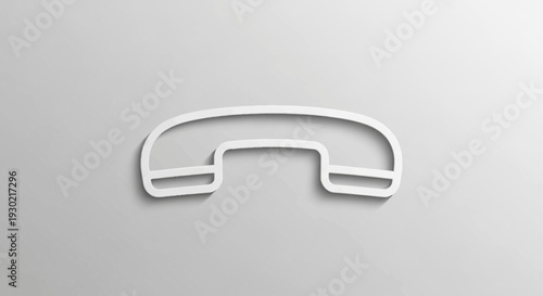Minimalist white telephone receiver icon on a textured grey background, communication concept