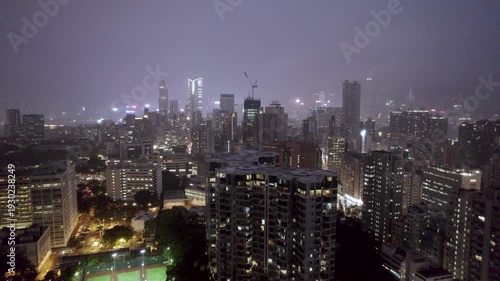 Wallpaper Mural Night illumination in a rainy and cloudy famous harbor cityscape aerial panorama 4k hong kong Torontodigital.ca