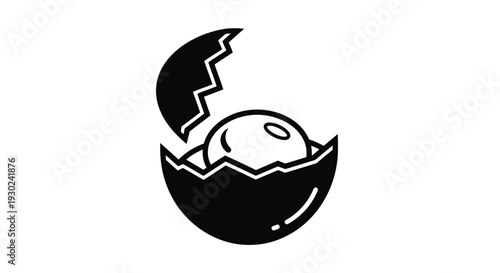 A black and white illustration of a penguin hatching from an egg