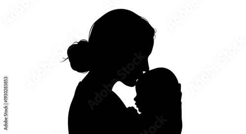 Silhouette of mother holding baby.
