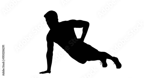 Silhouette of a person performing a plank exercise on their elbows