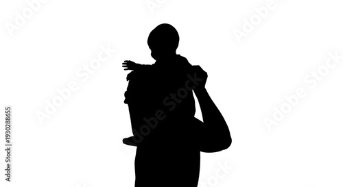Silhouette of man carrying child.