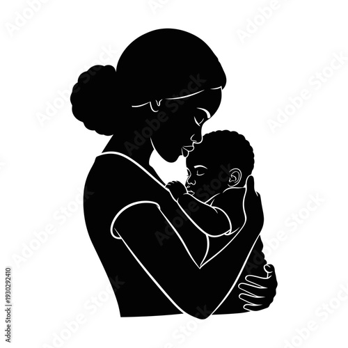 Loving mother tenderly holding and kissing her baby in a warm embrace