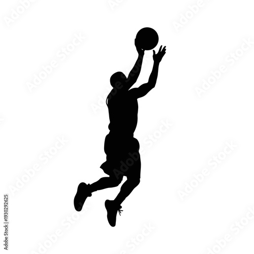 Dynamic basketball player jumping to score in mid-air