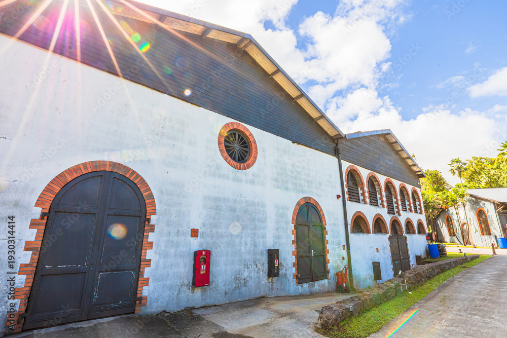 Naklejka premium Martinique, French Antilles - Dec 20, 2025: Habitation Saint-Etienne historic building and rum distillery in Martinique, French Antilles, making the famous Rhum Agricole