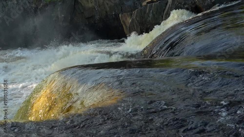 The edge of Voitsky Padun waterfall is close-up on a sunny summer day. Karelia, Russia