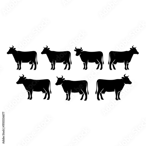 Seven black silhouetted cows standing in two parallel rows of three and one.