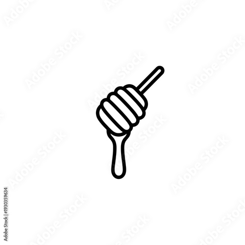 A woman’s hand holding a fork and spoon in the kitchen surrounded by cooking utensils and cutlery