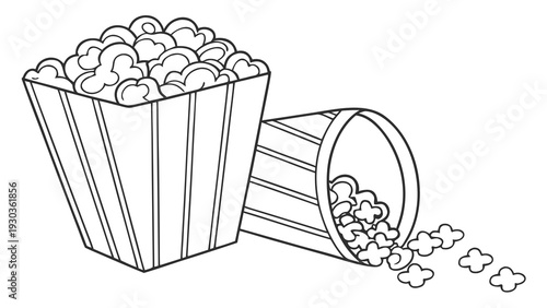 Popcorn overflowing from a striped bucket