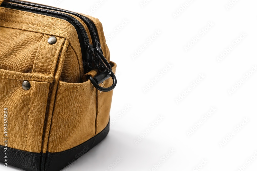 Naklejka premium Professional studio macro photo tan canvas tool bag corner showing weave and reinforced stitching isolated on pure white background