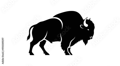 Black silhouette of a bison standing.