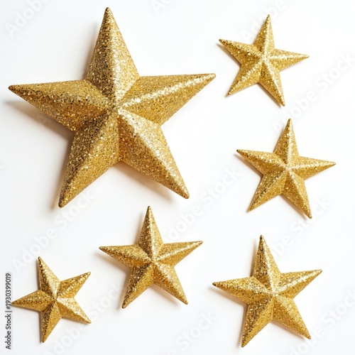 Six golden glitter stars on white background. Different sizes arrange on surface. Shiny decor elements, party celebration, holidays, Christmas time.