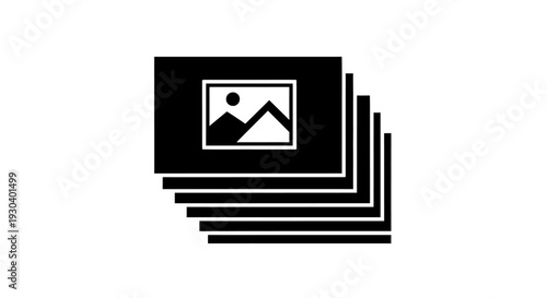 Stack of photos with mountain picture.