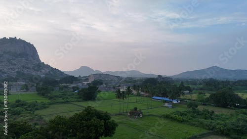 A beautiful drone view of Gingee Fort surrounded by rocky hills and greenery. The ancient walls and landscape highlight the historic beauty of this majestic fort from above.