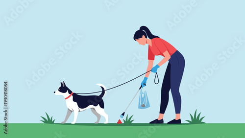 Responsible woman walking her dog on a leash and using a tool to pick up pet waste to keep the public park clean and hygienic for all.