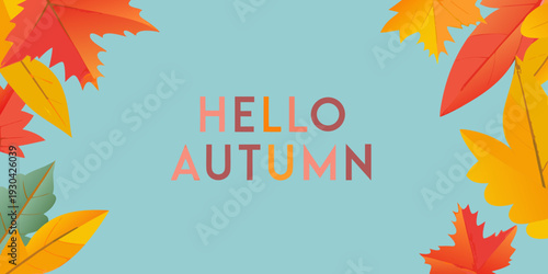 Colorful autumn leaves and a hello autumn greeting on blue background