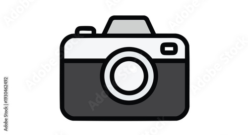 A simplified, cartoonish representation of a camera. The design features a rectangular body with rounded corners and a prominent lens