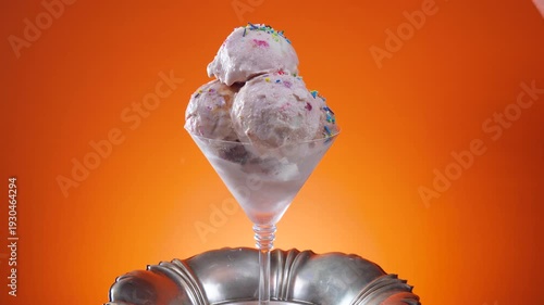 Wallpaper Mural A fruit ice cream in a glass bowl sprinkled with edible confetti slowly rotates against a bright background. Torontodigital.ca