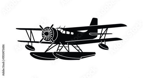 Black silhouette of a biplane with floats side view against white background