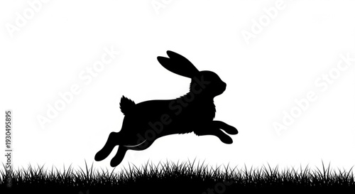 Black silhouette of a rabbit jumping over grass on a white background symbolizing freedom and joy in nature