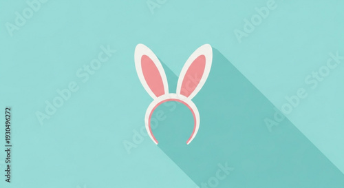 Pink bunny ears headband on turquoise background with shadow easter or party accessory