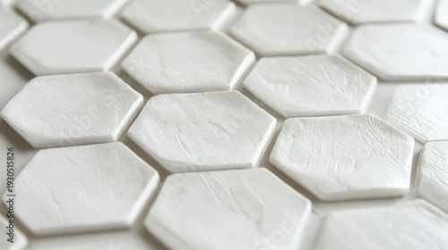 Close-up view of white hexagonal tiles.