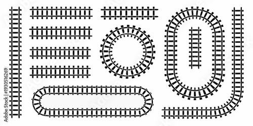 Black and white illustration of various toy train track layouts
