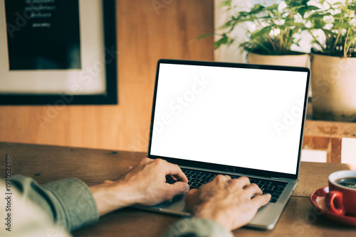 computer screen blank mockup.work using laptop with white background for advertising,contact business search information on desk at coffee shop.marketing and creative design