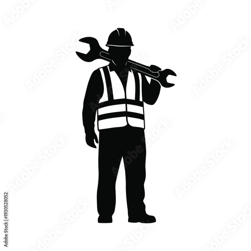 Worker in safety gear holding wrenches standing front view