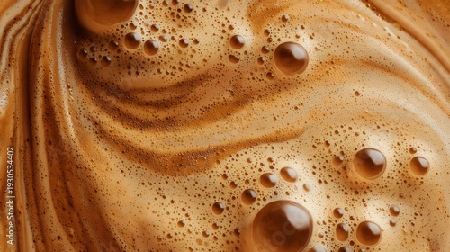 Coffee crema swirling texture with bubbles macro view