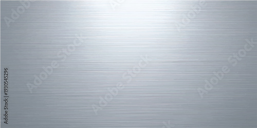 A polished silver stainless steel plate features a brushed metal texture with a shiny industrial gray pattern reflecting light across the metallic titanium and aluminum surface material
