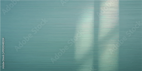 Closeup of a brushed teal metallic texture with subtle light reflections