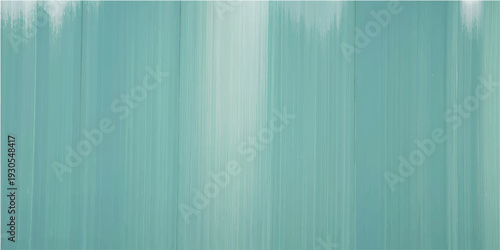 A detailed view of a brushed teal metallic texture with subtle light reflections
