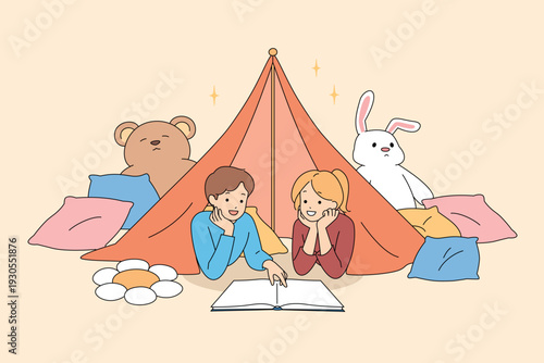 Children Read Cozy Stories. Siblings Enjoy Tent Time Giggling. Indoor Tent Adventure With Soft Toys And Lights