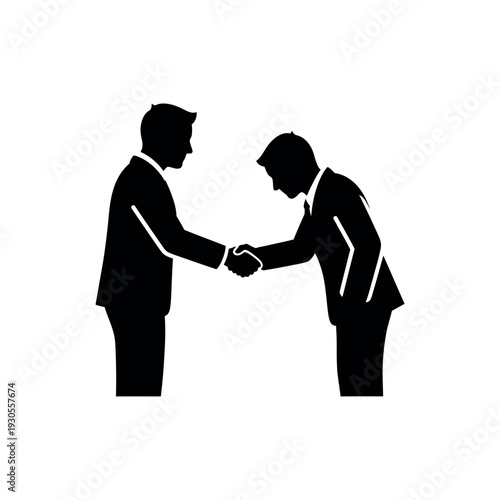 Two business people shaking hands and bowing in a formal greeting.