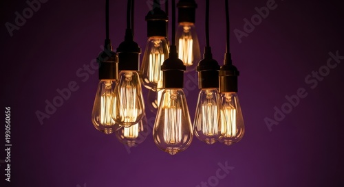 Vintage Edison Bulbs Hanging Dark Purple Background