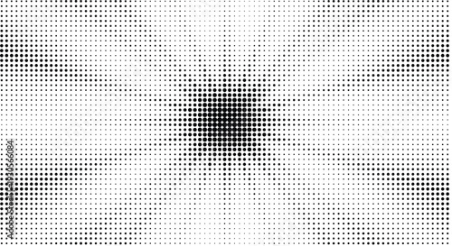 A close-up view of a textured surface with a central pattern resembling a starburst.