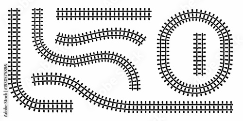 Black and white illustration of various train track layouts and curves