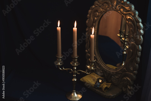 Mystical Mirror Reflection with Burning Candles in Vintage Candelabra on Dark Background