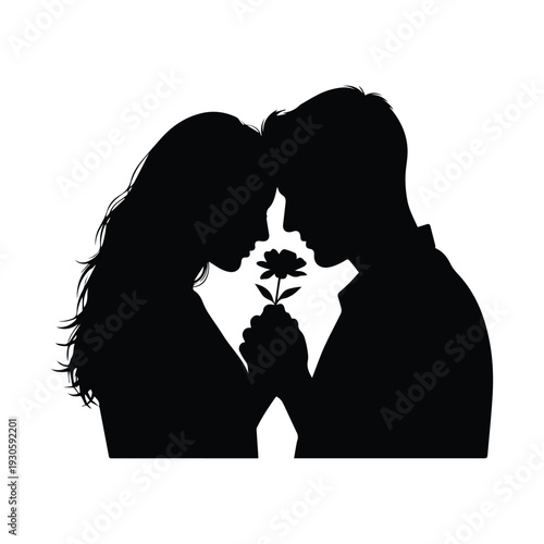 Romantic couple sharing tender moment with flower