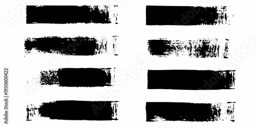 Abstract black brush strokes arranged in a grid on white background